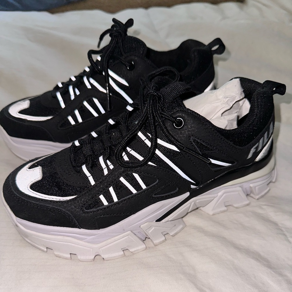 Fila black reflective platform shoes size 7. Used 2 times.